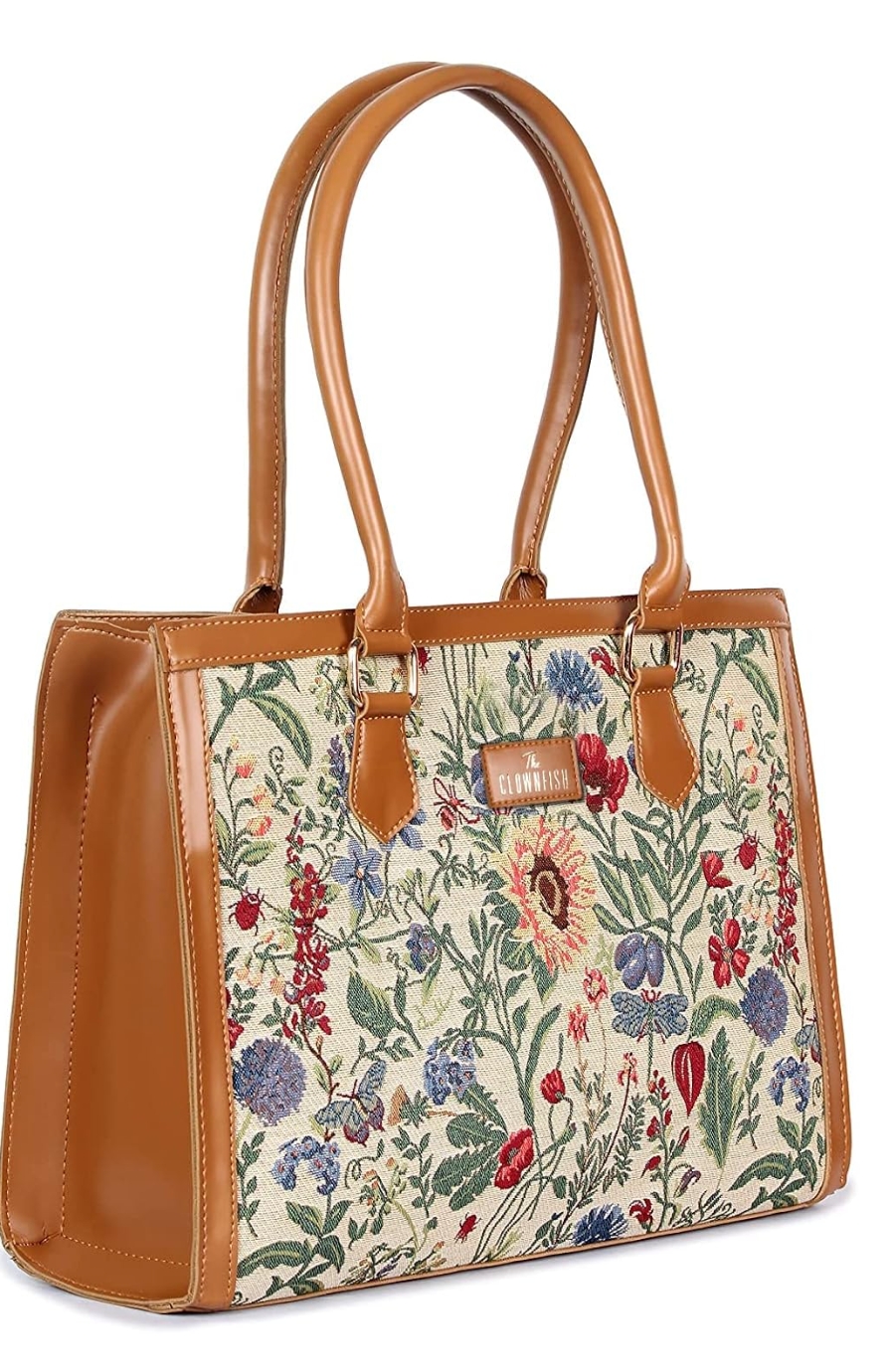 Floral fabric handbag with brown leather accents